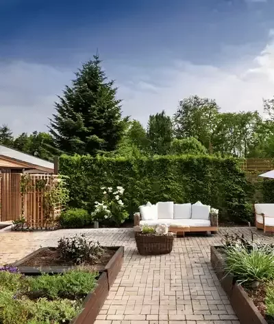 Garden with vegetable beds and path area designed and build by Roots Landscapes and Trees
